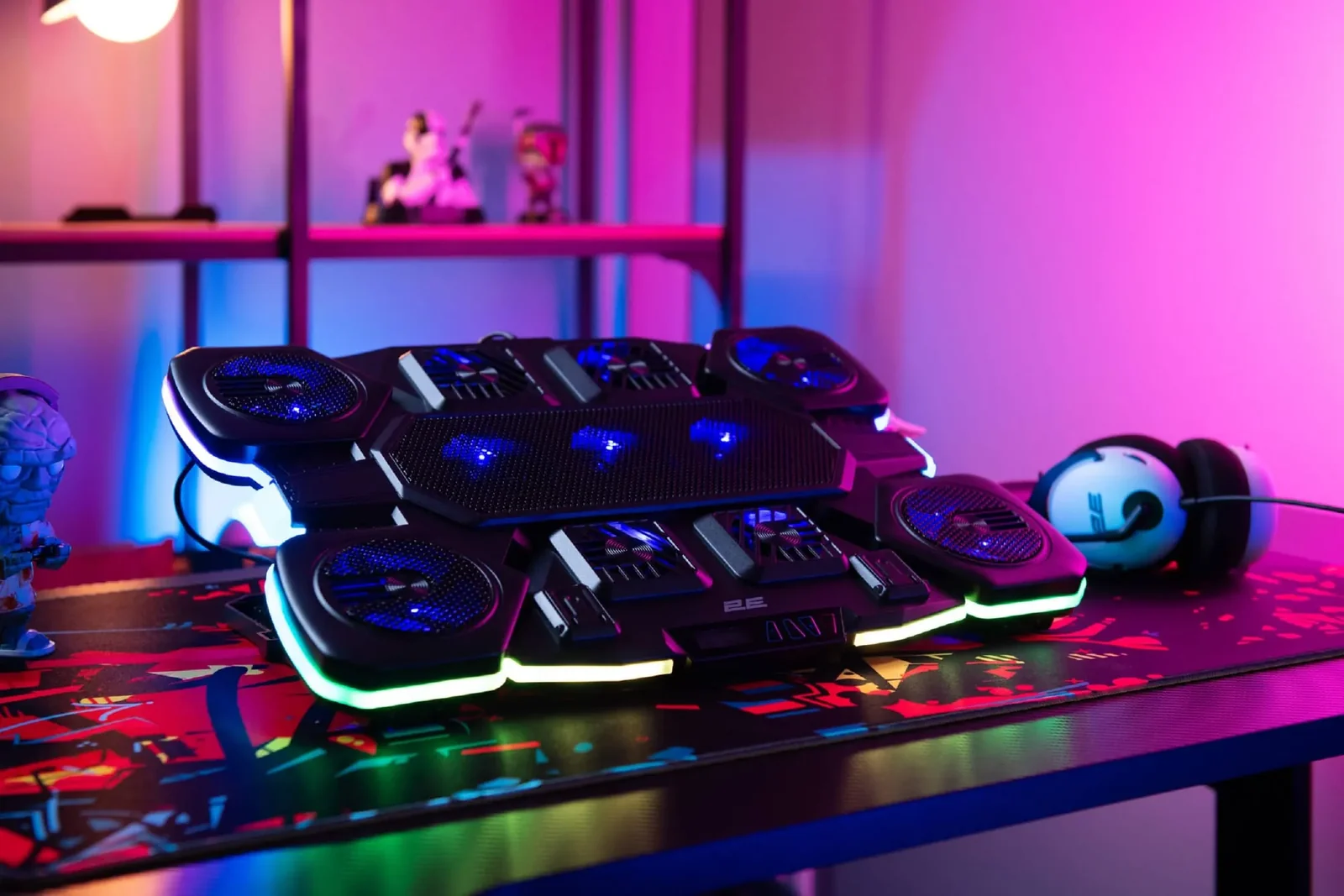TopMate C11 — the best laptop cooling pad of 2026 with six fans and RGB lighting on a gaming desk